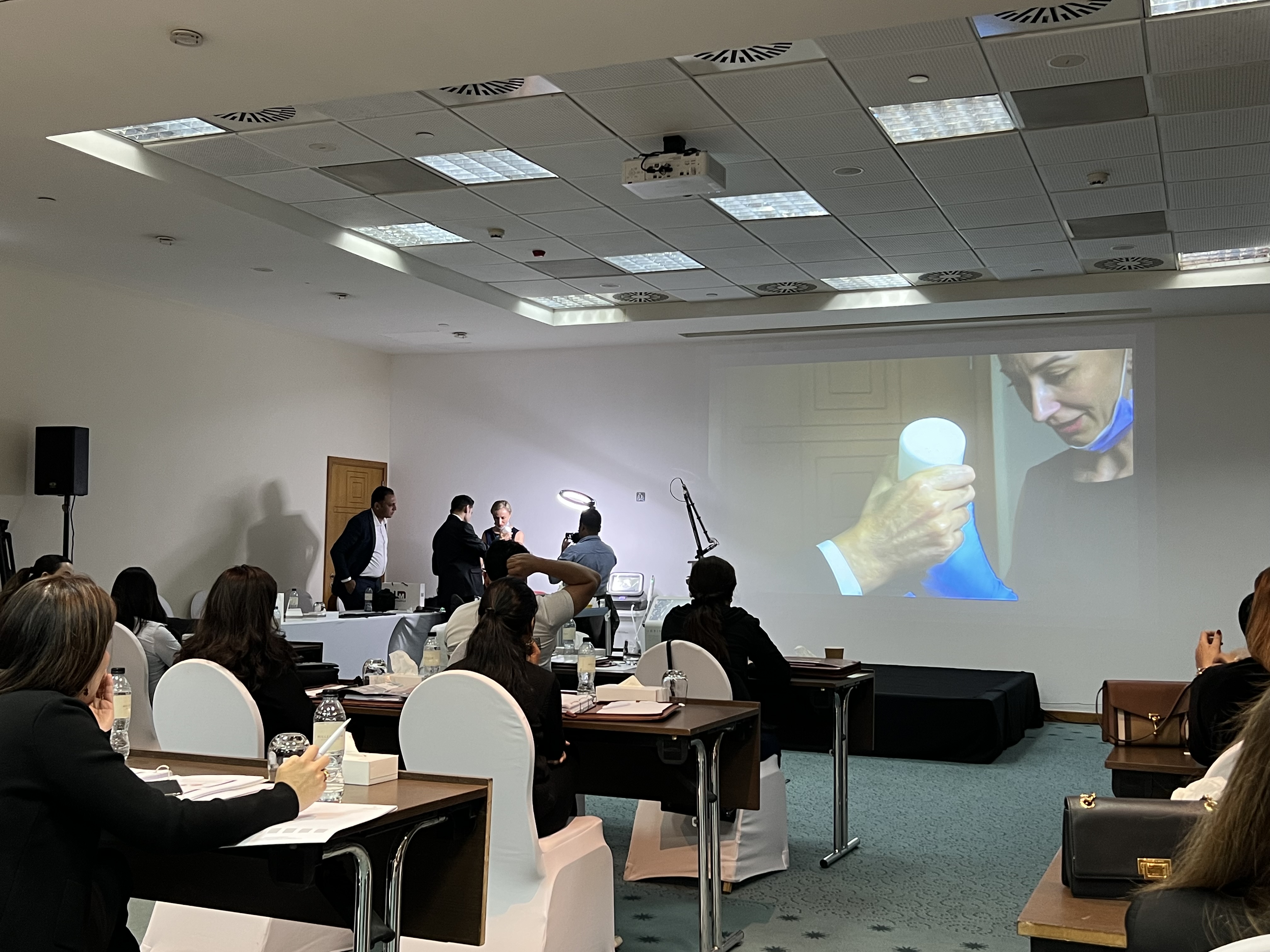 Dermatology professionals taking part in an educational training session