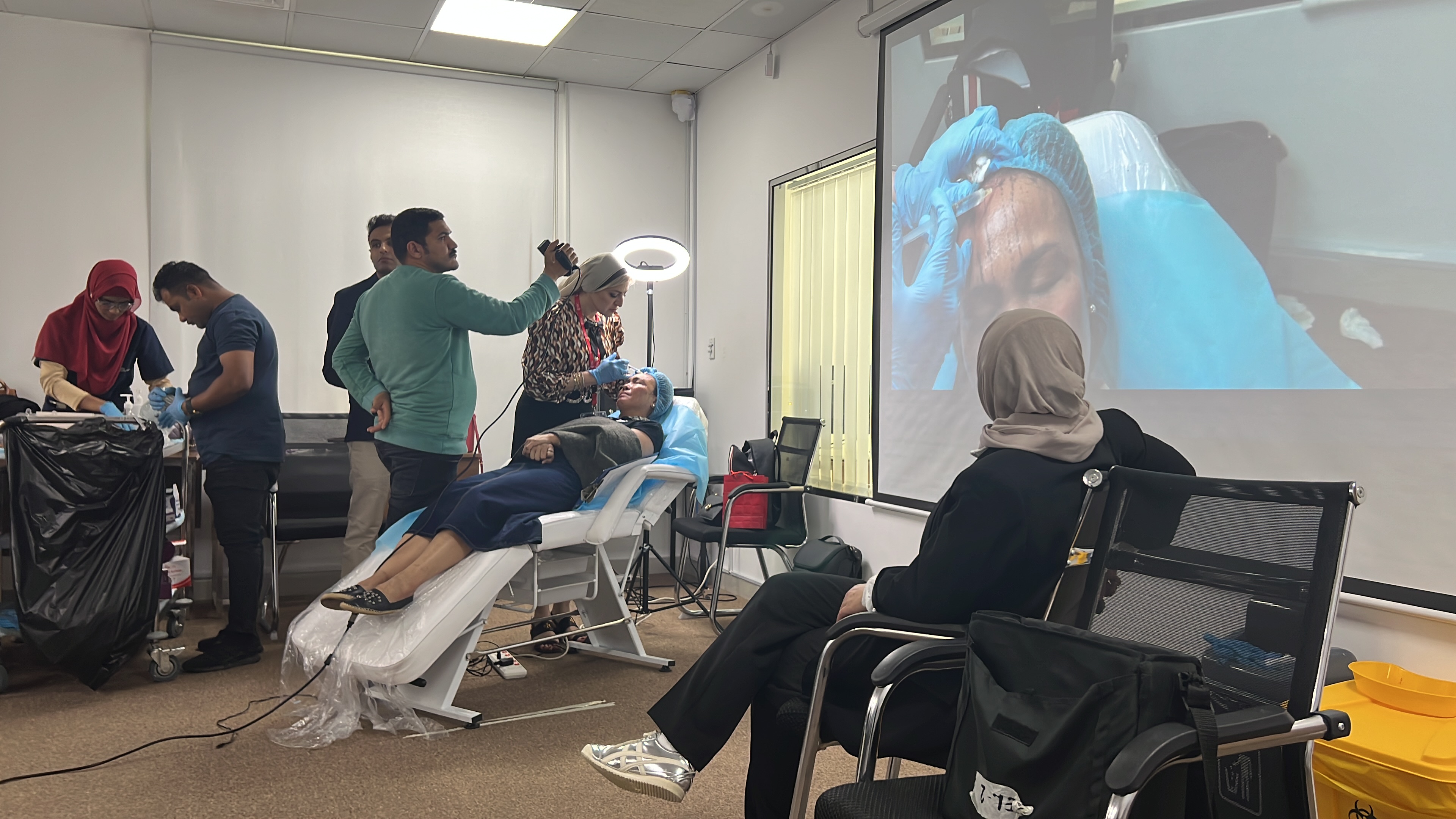 Practical dermatology workshop with a live demonstration